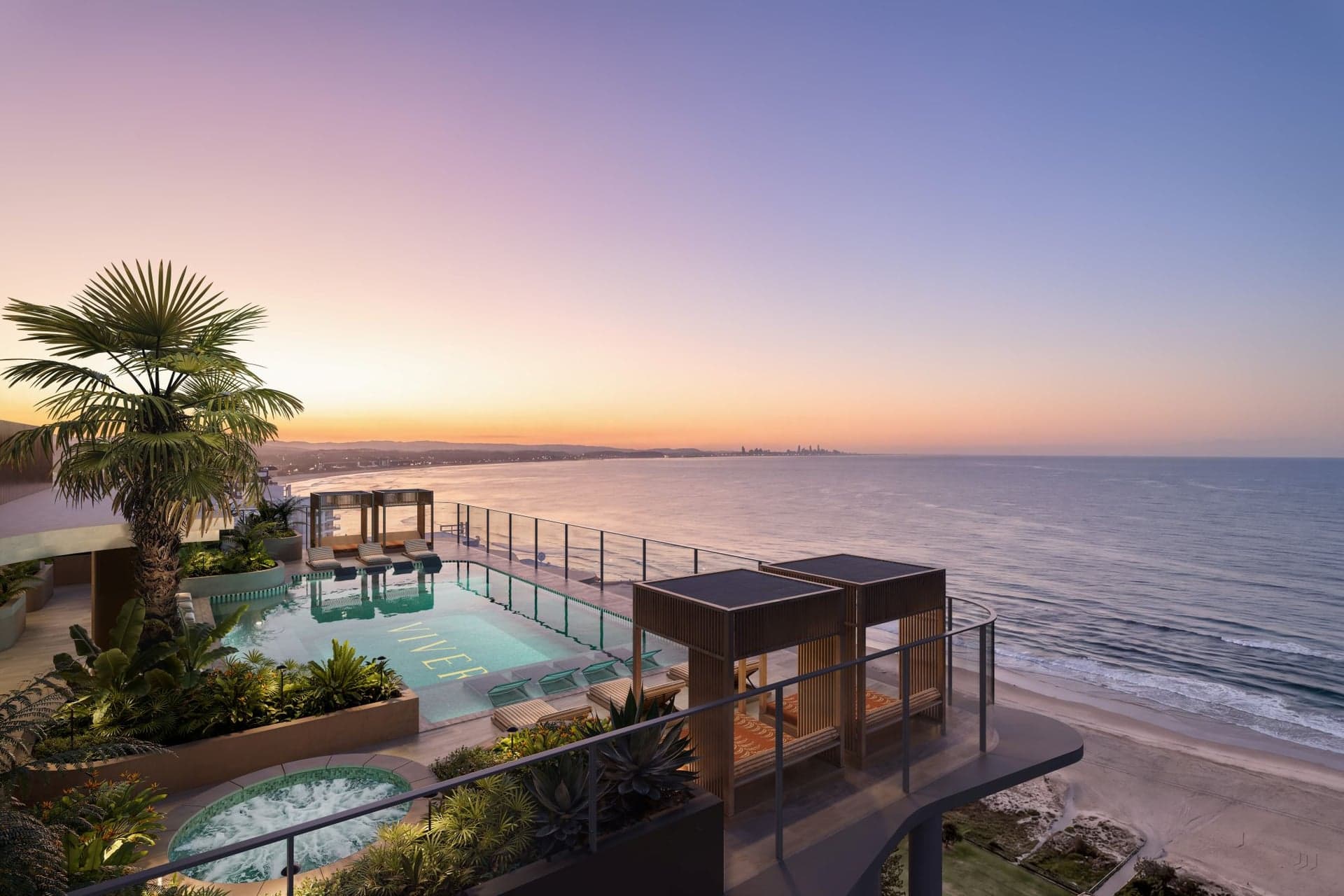 The Vivere rooftop pool terrace at dusk, looking north along the coast